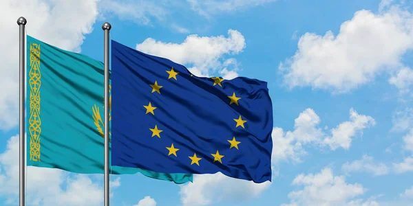 Kazakhstan and European Union flag waving in the wind against white cloudy blue sky together. Diplomacy concept, international relations. — Stock Photo, Image