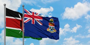 Kenya ve Cayman Adaları bayrağı birlikte beyaz bulutlu mavi gökyüzüne karşı rüzgarda sallayarak. Diplomasi kavramı, uluslararası ilişkiler.