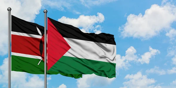 Bandera de Kenia y Palestina ondeando en el viento contra el cielo azul nublado blanco juntos. Concepto diplomático, relaciones internacionales . — Foto de Stock