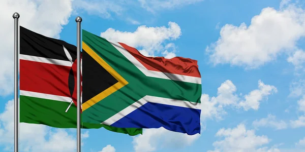 Kenya and South Africa flag waving in the wind against white cloudy blue sky together. Diplomacy concept, international relations. — Stock Photo, Image