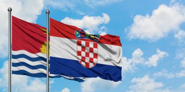 Kiribati ve Hırvatistan bayrağı birlikte beyaz bulutlu mavi gökyüzüne karşı rüzgarda sallayarak. Diplomasi kavramı, uluslararası ilişkiler.