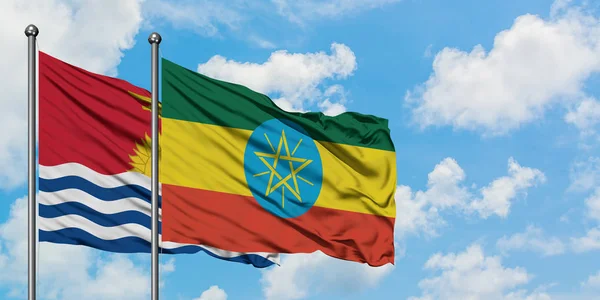 Kiribati and Ethiopia flag waving in the wind against white cloudy blue sky together. Diplomacy concept, international relations. — Stock Photo, Image