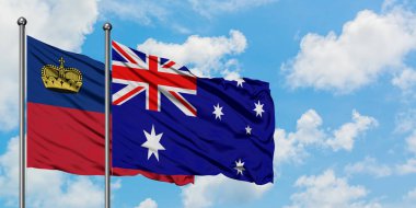 Liechtenstein ve Avustralya bayrağı birlikte beyaz bulutlu mavi gökyüzüne karşı rüzgarda sallayarak. Diplomasi kavramı, uluslararası ilişkiler.