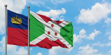 Liechtenstein ve Burundi bayrağı birlikte beyaz bulutlu mavi gökyüzüne karşı rüzgarda sallayarak. Diplomasi kavramı, uluslararası ilişkiler.