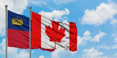 Liechtenstein ve Kanada bayrağı birlikte beyaz bulutlu mavi gökyüzüne karşı rüzgarda sallayarak. Diplomasi kavramı, uluslararası ilişkiler.