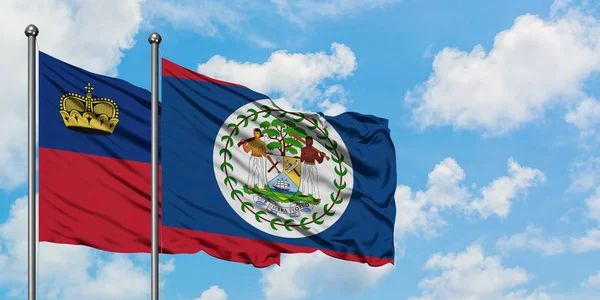 Bandera de Liechtenstein y Belice ondeando en el viento contra el cielo azul nublado blanco juntos. Concepto diplomático, relaciones internacionales . — Foto de Stock