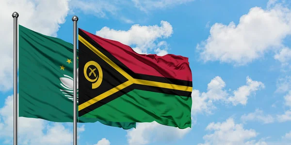 Macao and Vanuatu flag waving in the wind against white cloudy blue sky together. Diplomacy concept, international relations. — Stock Photo, Image