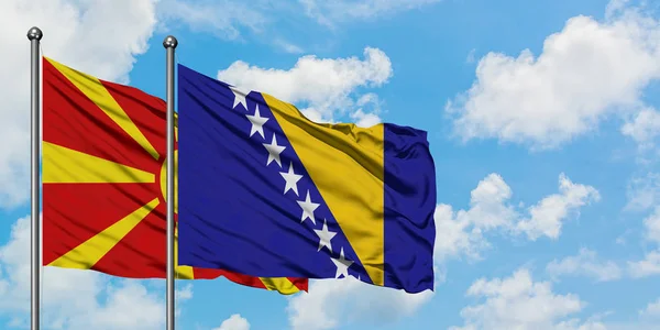 마케도니아와 보스니아 헤르체고비나 국기함께 흰색 흐린 푸른 하늘에 대한 바람에 흔들리고. 외교 개념, 국제 관계. — 스톡 사진