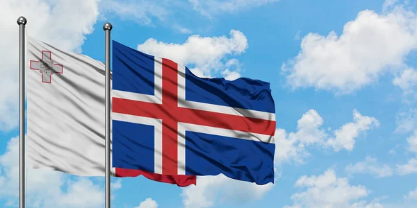Мальта і Ісландія прапор розмахуючи в вітру проти білого хмарного синього неба разом. Концепція дипломатії, міжнародні відносини. — стокове фото