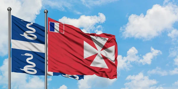 Martinica y Wallis y la bandera de Futuna ondeando en el viento contra el cielo azul nublado blanco juntos. Concepto diplomático, relaciones internacionales . — Foto de Stock