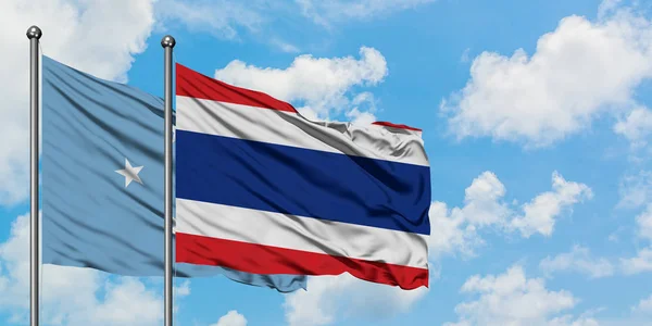 Micronesia and Thailand flag waving in the wind against white cloudy blue sky together. Diplomacy concept, international relations. — Stock Photo, Image