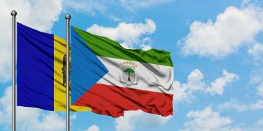 Moldova and Equatorial Guinea flag waving in the wind against white cloudy blue sky together. Diplomacy concept, international relations. clipart