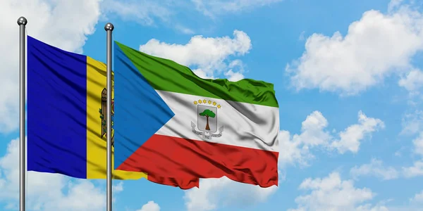 Moldova and Equatorial Guinea flag waving in the wind against white cloudy blue sky together. Diplomacy concept, international relations. — Stock Photo, Image