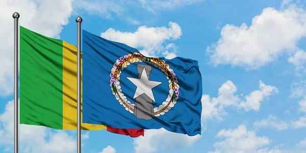 Mali and Northern Mariana Islands flag waving in the wind against white cloudy blue sky together. Diplomacy concept, international relations. — Stock Photo, Image