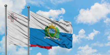 Malta ve San Marino bayrağı birlikte beyaz bulutlu mavi gökyüzüne karşı rüzgarda sallayarak. Diplomasi kavramı, uluslararası ilişkiler.