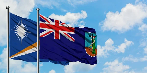 马绍尔群岛和蒙特塞拉特国旗在风中飘扬，与白云相间的蓝天相一起。外交概念、国际关系. — 图库照片