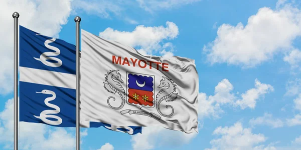 Martinique och Mayotte sjunker vifta i vinden mot vit grumlig blå himmel tillsammans. Diplomatisk koncept, internationella relationer. — Stockfoto
