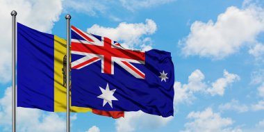 Moldova ve Heard Adası ve Mcdonald Adaları bayrağı birlikte beyaz bulutlu mavi gökyüzüne karşı rüzgarda sallayarak. Diplomasi kavramı, uluslararası ilişkiler.