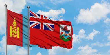 Moğolistan ve Bermuda bayrağı birlikte beyaz bulutlu mavi gökyüzüne karşı rüzgarda sallayarak. Diplomasi kavramı, uluslararası ilişkiler.