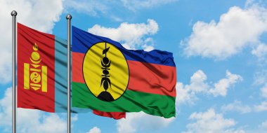 Moğolistan ve Yeni Kaledonya bayrağı birlikte beyaz bulutlu mavi gökyüzüne karşı rüzgarda sallayarak. Diplomasi kavramı, uluslararası ilişkiler.