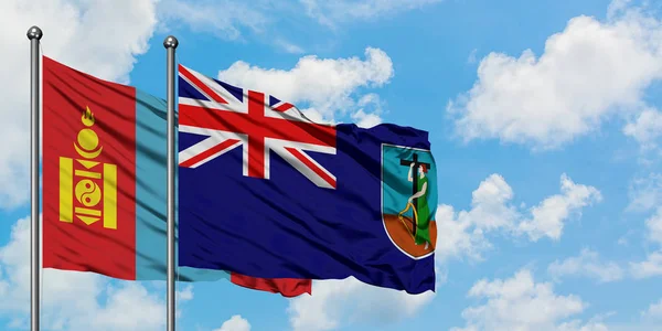 Bandera de Mongolia y Montserrat ondeando en el viento contra el cielo azul nublado blanco juntos. Concepto diplomático, relaciones internacionales . — Foto de Stock