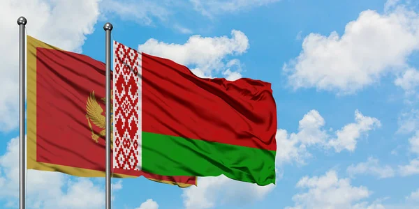 Montenegro and Belarus flag waving in the wind against white cloudy blue sky together. Diplomacy concept, international relations. — Stock Photo, Image