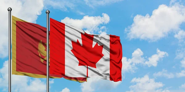 Bandera de Montenegro y Canadá ondeando en el viento contra el cielo azul nublado blanco juntos. Concepto diplomático, relaciones internacionales . — Foto de Stock