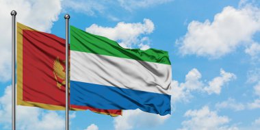 Karadağ ve Sierra Leone bayrağı birlikte beyaz bulutlu mavi gökyüzüne karşı rüzgarda sallayarak. Diplomasi kavramı, uluslararası ilişkiler.