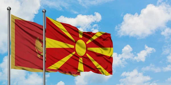 Montenegro en Macedonië vlag zwaaien in de wind tegen witte bewolkte blauwe hemel samen. Diplomatie concept, internationale betrekkingen. — Stockfoto