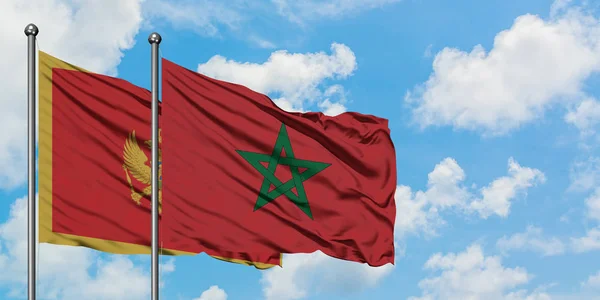 黑山和摩洛哥国旗在风中飘扬，白云蓝天相聚。外交概念、国际关系. — 图库照片