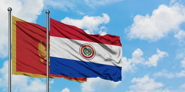 Чорногорія і Парагвай прапор розмахував вітром проти білого хмарного синього неба разом. Концепція дипломатії, міжнародні відносини. — стокове фото