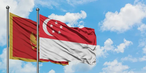 Montenegro e Singapura acenando ao vento contra o céu azul nublado branco juntos. Conceito de diplomacia, relações internacionais . — Fotografia de Stock