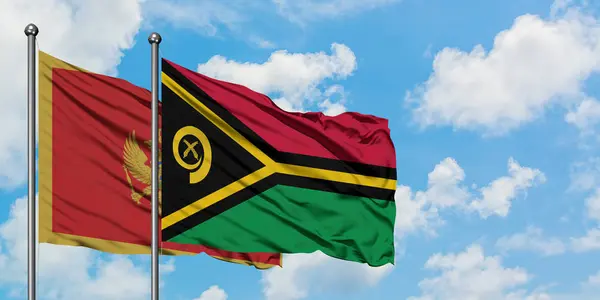 黑山和瓦努阿图国旗在风中飘扬，白云蓝天相聚。外交概念、国际关系. — 图库照片