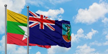 Myanmar ve Montserrat bayrağı birlikte beyaz bulutlu mavi gökyüzüne karşı rüzgarda sallayarak. Diplomasi kavramı, uluslararası ilişkiler.