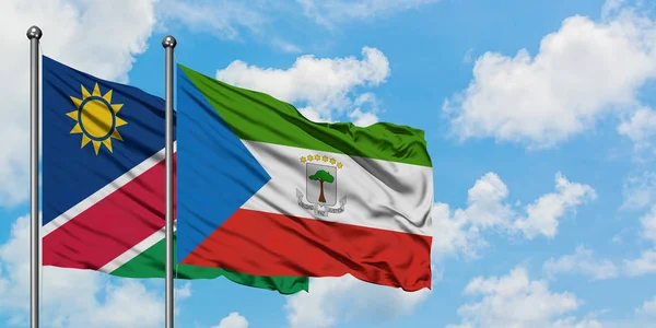 Namibia and Equatorial Guinea flag waving in the wind against white cloudy blue sky together. Diplomacy concept, international relations. — Stock Photo, Image