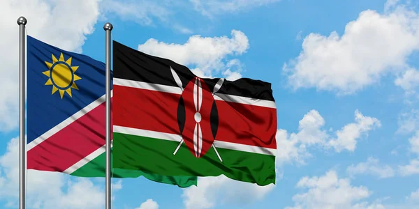 Namíbia és Kenya zászló integetett a szél ellen, fehér felhős kék ég együtt. Diplomáciai koncepció, nemzetközi kapcsolatok. — Stock Fotó
