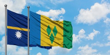 Nauru ve Saint Vincent ve Grenadinler bayrağı birlikte beyaz bulutlu mavi gökyüzüne karşı rüzgarda sallayarak. Diplomasi kavramı, uluslararası ilişkiler.