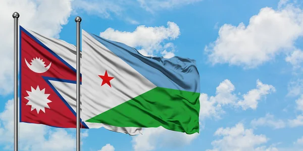 Bandera de Nepal y Yibuti ondeando en el viento contra el cielo azul nublado blanco juntos. Concepto diplomático, relaciones internacionales . — Foto de Stock