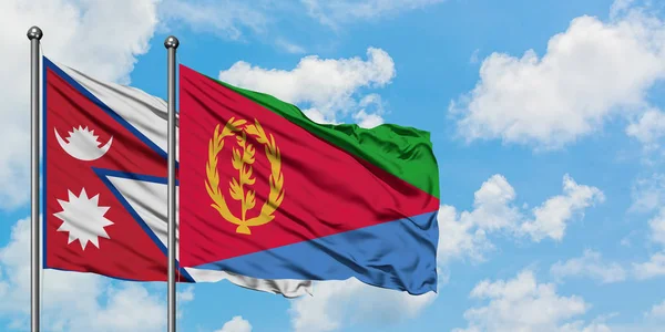 Bandera de Nepal y Eritrea ondeando en el viento contra el cielo azul nublado blanco juntos. Concepto diplomático, relaciones internacionales . — Foto de Stock