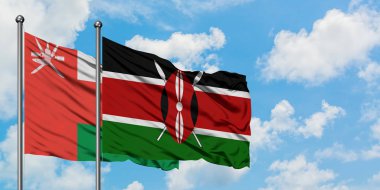 Umman ve Kenya bayrağı birlikte beyaz bulutlu mavi gökyüzüne karşı rüzgarda sallayarak. Diplomasi kavramı, uluslararası ilişkiler.