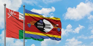 Umman ve Svaziland bayrağı birlikte beyaz bulutlu mavi gökyüzüne karşı rüzgarda sallayarak. Diplomasi kavramı, uluslararası ilişkiler.