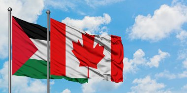 Filistin ve Kanada bayrağı birlikte beyaz bulutlu mavi gökyüzüne karşı rüzgarda sallayarak. Diplomasi kavramı, uluslararası ilişkiler.