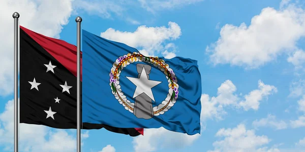 Papua New Guinea and Northern Mariana Islands flag waving in the wind against white cloudy blue sky together. Diplomacy concept, international relations. — Stock Photo, Image
