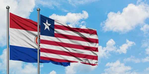 Парагвай і Ліберії прапор розмахуючи в вітру проти білого хмарного синього неба разом. Концепція дипломатії, міжнародні відносини. — стокове фото