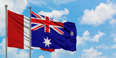 Peru ve Heard Adası ve Mcdonald Adaları bayrağı birlikte beyaz bulutlu mavi gökyüzüne karşı rüzgarda sallayarak. Diplomasi kavramı, uluslararası ilişkiler.