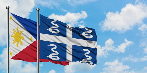 Philippines and Martinique flag waving in the wind against white cloudy blue sky together. Diplomacy concept, international relations. — Stock Photo, Image