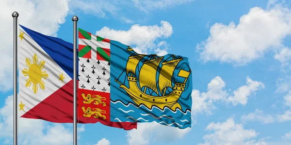 Filipinas e São Pedro e Miquelon acenando com o vento contra o céu azul nublado branco juntos. Conceito de diplomacia, relações internacionais . — Fotografia de Stock
