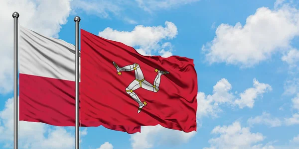 Poland and Isle Of Man flag waving in the wind against white cloudy blue sky together. Diplomacy concept, international relations. — Stock Photo, Image