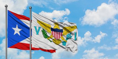 Porto Riko ve Amerika Birleşik Devletleri Virgin Adaları bayrağı birlikte beyaz bulutlu mavi gökyüzüne karşı rüzgarda sallayarak. Diplomasi kavramı, uluslararası ilişkiler.