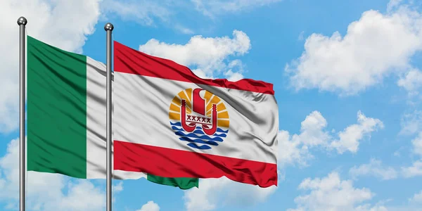 Nigeria and French Polynesia flag waving in the wind against white cloudy blue sky together. Diplomacy concept, international relations. — Stock Photo, Image